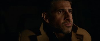 Movie still from “Sweet Girl” (2021), directed by Brian Andrew Mendoza – A person wearing a jacket; Close Up shot, Over the shoulder angle