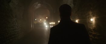 Movie still from “Sweet Girl” (2021), directed by Brian Andrew Mendoza – A man standing in the dark with a car on the road; Close Up shot, Over the shoulder angle