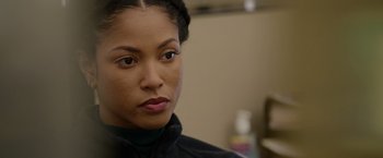 Movie still from “Sweet Girl” (2021), directed by Brian Andrew Mendoza – A person wearing a black jacket; Close Up shot, Over the shoulder angle