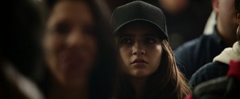 Movie still from “Sweet Girl” (2021), directed by Brian Andrew Mendoza – A person wearing a hat; Close Up shot, Over the shoulder angle