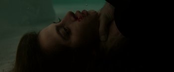 Movie still from “Sweet Girl” (2021), directed by Brian Andrew Mendoza – A person with a knife on their face; Extreme Close Up shot, Low angle