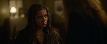 Movie still from “Sweet Girl” (2021), directed by Brian Andrew Mendoza – A young woman with a bandage on her head; Close Up shot, Over the shoulder angle