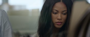 Movie still from “Sweet Girl” (2021), directed by Brian Andrew Mendoza – A person with long black hair; Close Up shot, Over the shoulder angle