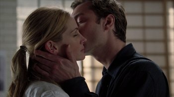 Movie still from “Closer” (2004), directed by Mike Nichols – A man and a woman are kissing in a room; Close Up shot, Low angle