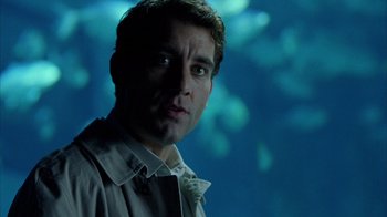 Movie still from “Closer” (2004), directed by Mike Nichols – A person wearing a shirt and tie; Close Up shot, Over the shoulder angle