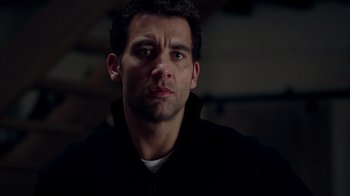 Movie still from “Closer” (2004), directed by Mike Nichols – A person wearing a black jacket; Close Up shot, Low angle