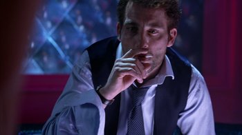 Movie still from “Closer” (2004), directed by Mike Nichols – A person wearing a suit and tie; Close Up shot, Low angle