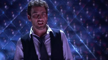 Movie still from “Closer” (2004), directed by Mike Nichols – A person wearing a vest and a tie; Close Up shot, Low angle