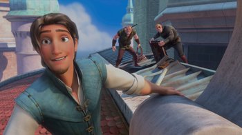 Movie still from “Tangled” (2010), directed by Byron Howard – A group of people on a roof with a man in the background; Wide shot, Low angle
