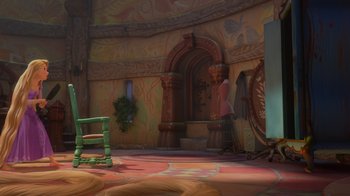 Movie still from “Tangled” (2010), directed by Byron Howard – A room with a chair and a fireplace in it; Wide shot, Over the shoulder angle