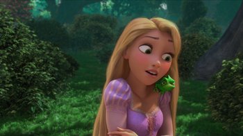 Movie still from “Tangled” (2010), directed by Byron Howard – A woman with a frog on her shoulder; Close Up shot, Over the shoulder angle
