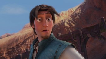 Movie still from “Tangled” (2010), directed by Byron Howard – A person looking surprised with mountains in the background; Close Up shot, Over the shoulder angle