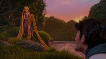 Movie still from “Tangled” (2010), directed by Byron Howard – A scene of a girl and a boy in a field; Extreme Wide shot, Over the shoulder angle