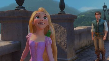 Movie still from “Tangled” (2010), directed by Byron Howard – A woman with long blonde hair holding a green bird; Close Up shot, Over the shoulder angle