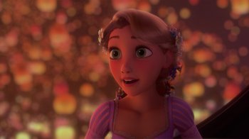 Movie still from “Tangled” (2010), directed by Byron Howard – A girl is looking at the camera in a scene from tangled; Close Up shot, Over the shoulder angle