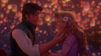 Movie still from “Tangled” (2010), directed by Byron Howard – A man and a woman are looking at each other in front of lights; Medium shot, Over the shoulder angle