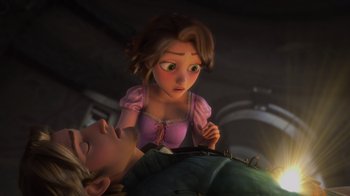 Movie still from “Tangled” (2010), directed by Byron Howard – A young woman is looking at a man lying on a bed; Medium shot, High angle