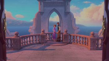 Movie still from “Tangled” (2010), directed by Byron Howard – A couple of people standing next to each other on top of a building; Extreme Wide shot, High angle