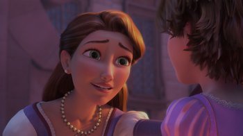 Movie still from “Tangled” (2010), directed by Byron Howard – A woman with long brown hair wearing a pearl necklace; Close Up shot, Over the shoulder angle