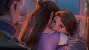 Movie still from “Tangled” (2010), directed by Byron Howard – A person holding a child in her arms; Close Up shot, Over the shoulder angle