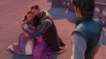 Movie still from “Tangled” (2010), directed by Byron Howard – A group of people that are sitting on the ground together; Wide shot, High angle