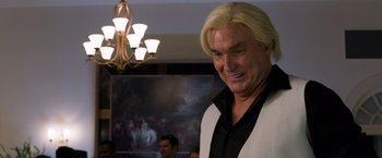 Movie still from “Ted 2” (2015), directed by Seth MacFarlane – A person with long blond hair; Close Up shot, Over the shoulder angle