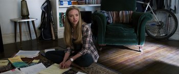 Movie still from “Ted 2” (2015), directed by Seth MacFarlane – A woman sitting on the ground in a living room; Medium shot, High angle
