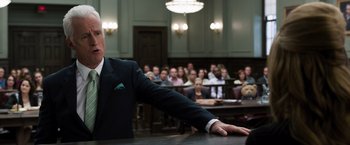 Movie still from “Ted 2” (2015), directed by Seth MacFarlane – A man in a suit is giving a speech in front of an audience; Medium shot, Low angle