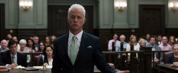 Movie still from “Ted 2” (2015), directed by Seth MacFarlane – A man in a suit and tie in a court room; Close Up shot, Low angle