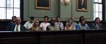 Movie still from “Ted 2” (2015), directed by Seth MacFarlane – A group of people sitting in front of a judge's bench; Medium shot, High angle