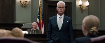 Movie still from “Ted 2” (2015), directed by Seth MacFarlane – A man standing in front of a judge in a courtroom; Medium shot, Low angle