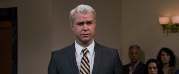 Movie still from “Ted 2” (2015), directed by Seth MacFarlane – A man in a suit and a striped tie; Close Up shot, Over the shoulder angle