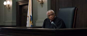 Movie still from “Ted 2” (2015), directed by Seth MacFarlane – An old man in a court room wearing a judge's robe; Close Up shot, Over the shoulder angle