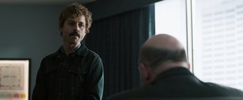 Movie still from “Ted 2” (2015), directed by Seth MacFarlane – A man with a beard and mustache looking at a bald man; Close Up shot, Over the shoulder angle