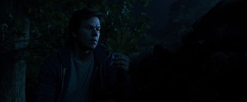 Movie still from “Ted 2” (2015), directed by Seth MacFarlane – A man sitting in the dark holding a plant; Close Up shot, Low angle