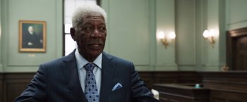 Movie still from “Ted 2” (2015), directed by Seth MacFarlane – An older man wearing a suit and tie; Close Up shot, Low angle