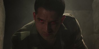 Movie still from “Teen Wolf: The Movie” (2023), directed by Russell Mulcahy – A person with red eyes; Close Up shot, High angle