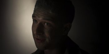 Movie still from “Teen Wolf: The Movie” (2023), directed by Russell Mulcahy – A person's face in the dark; Close Up shot, High angle