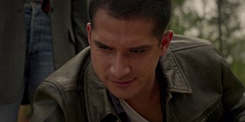 Movie still from “Teen Wolf: The Movie” (2023), directed by Russell Mulcahy – A person wearing a leather jacket; Close Up shot, High angle