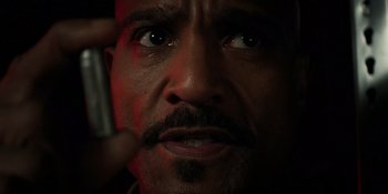 Movie still from “Teen Wolf: The Movie” (2023), directed by Russell Mulcahy – A person holding a cell phone; Extreme Close Up shot, High angle