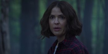 Movie still from “Teen Wolf: The Movie” (2023), directed by Russell Mulcahy – A person wearing a plaid shirt; Close Up shot, Over the shoulder angle