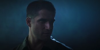 Movie still from “Teen Wolf: The Movie” (2023), directed by Russell Mulcahy – A person wearing a leather jacket; Close Up shot, Low angle