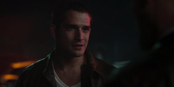 Movie still from “Teen Wolf: The Movie” (2023), directed by Russell Mulcahy – A person wearing a leather jacket; Close Up shot, Over the shoulder angle