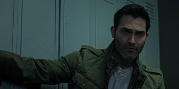 Movie still from “Teen Wolf: The Movie” (2023), directed by Russell Mulcahy – A person wearing a jacket; Close Up shot, Over the shoulder angle