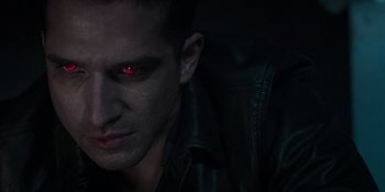 Movie still from “Teen Wolf: The Movie” (2023), directed by Russell Mulcahy – A person wearing a leather jacket; Close Up shot, High angle