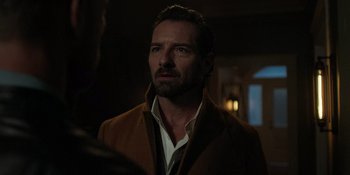 Movie still from “Teen Wolf: The Movie” (2023), directed by Russell Mulcahy – A person wearing a jacket; Close Up shot, Over the shoulder angle