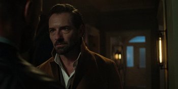 Movie still from “Teen Wolf: The Movie” (2023), directed by Russell Mulcahy – A person wearing a jacket; Close Up shot, Over the shoulder angle