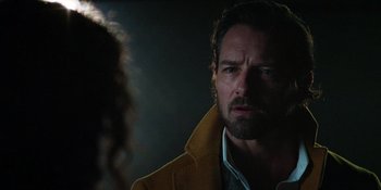 Movie still from “Teen Wolf: The Movie” (2023), directed by Russell Mulcahy – A person wearing a yellow jacket; Close Up shot, Over the shoulder angle