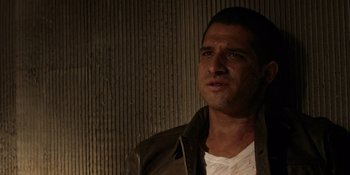 Movie still from “Teen Wolf: The Movie” (2023), directed by Russell Mulcahy – A person wearing a leather jacket; Close Up shot, Over the shoulder angle