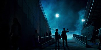 Movie still from “Teen Wolf: The Movie” (2023), directed by Russell Mulcahy – A group of people standing next to each other on a bridge; Extreme Wide shot, Over the shoulder angle